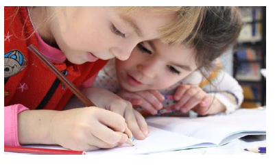 two students writing