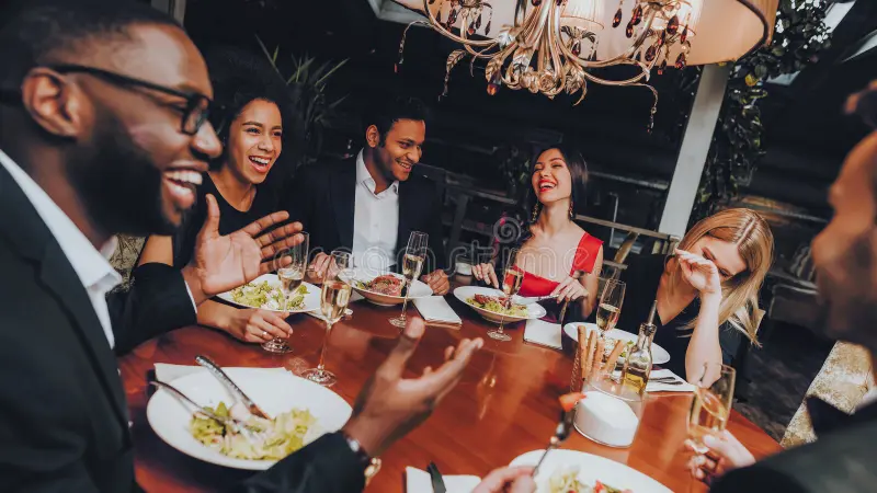 Friends eating dinner together